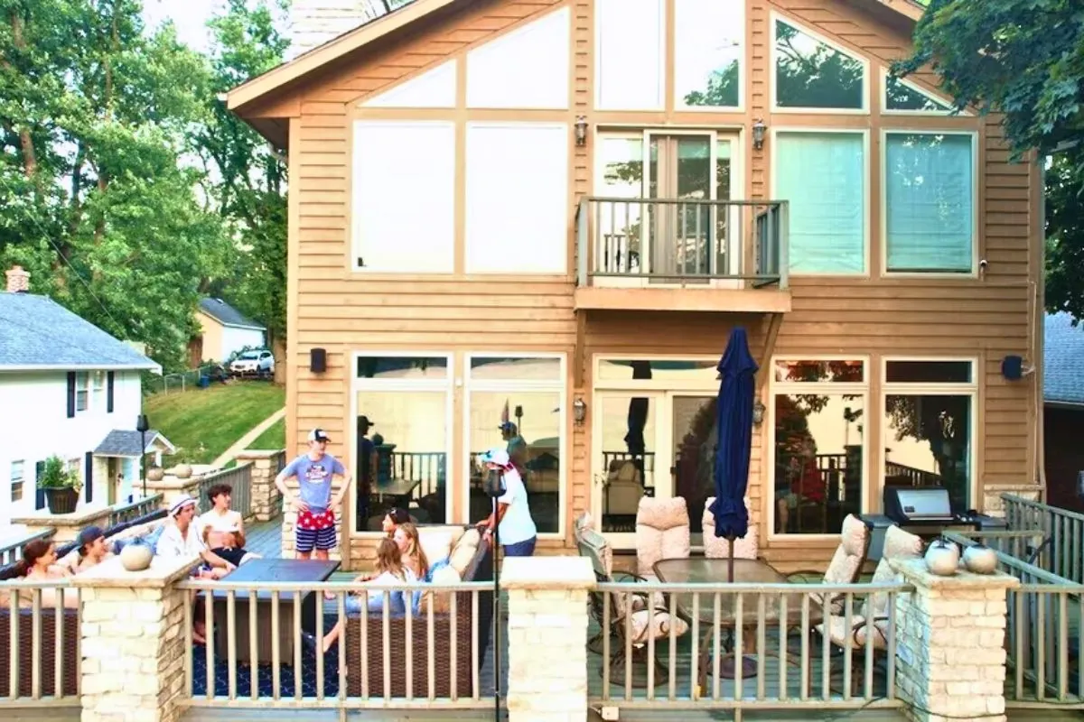 group of friends hanging out on house deck