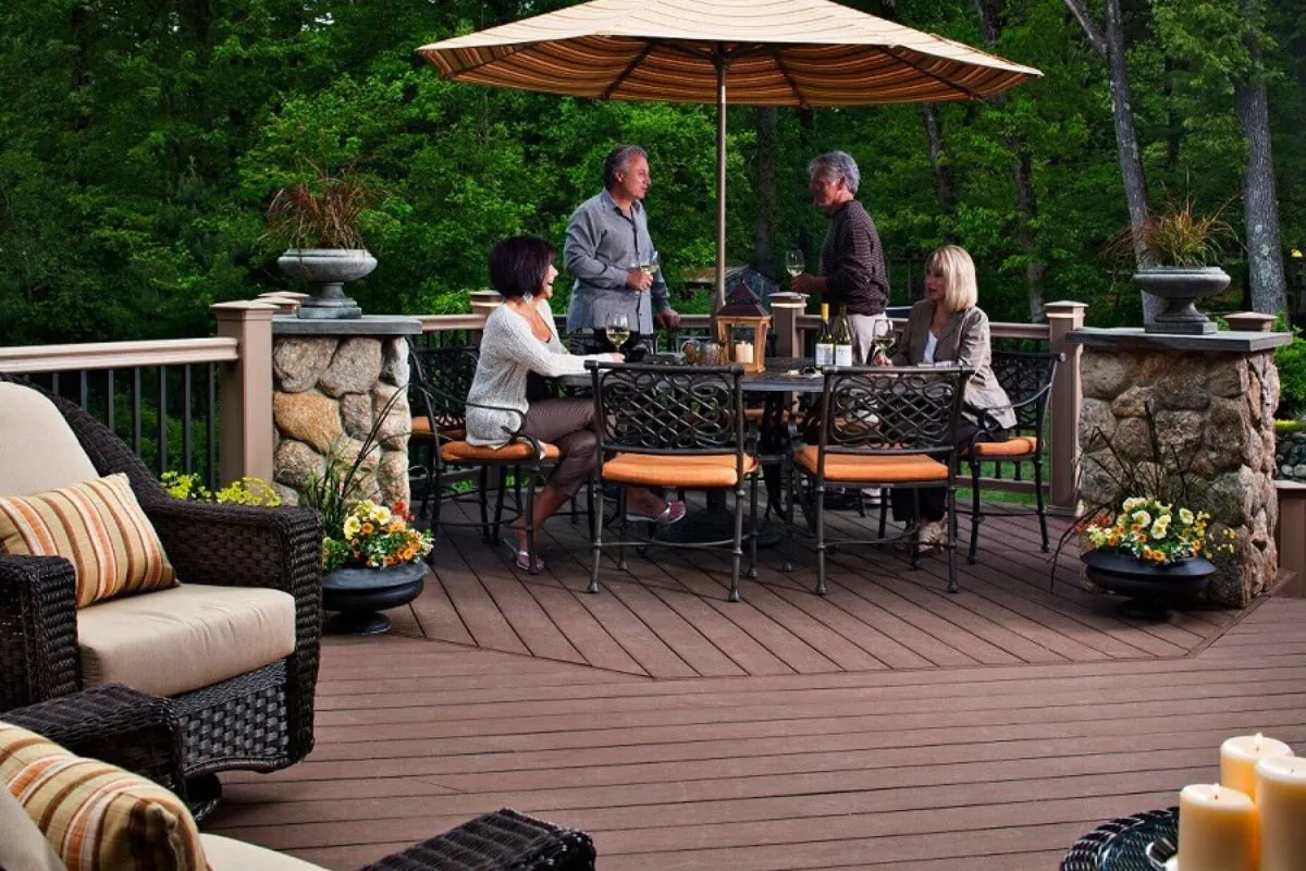 two couples drinking champagne on deck