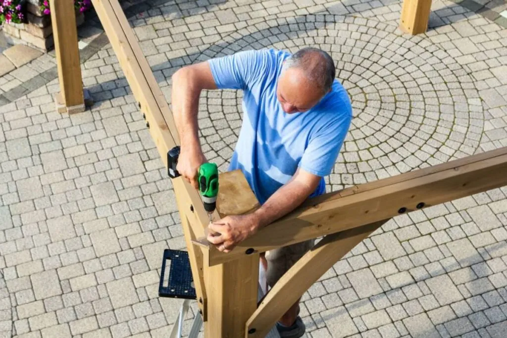 male contractor working on pergola installation project in Cherry Hill NJ 